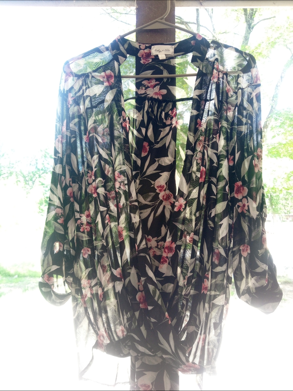 Sheer Floral Top With A Sexy Neckline In The Front.